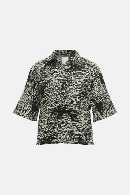 Gilet noir d'OBJECT avec un motif abstrait ondulé et des manches courtes.