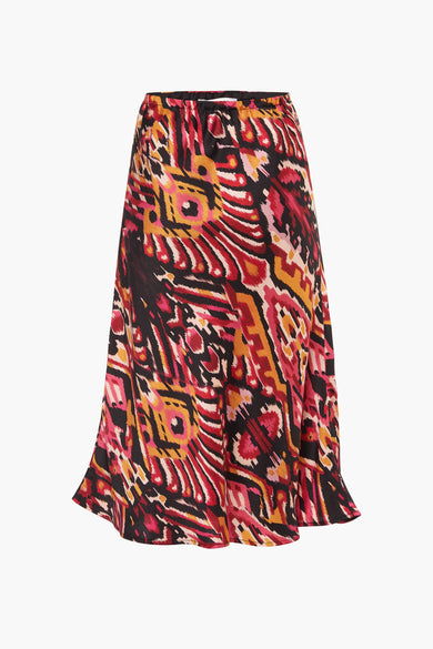 Lange oranje rok van Morgan De Toi, met een abstract, veelkleurig patroon.
