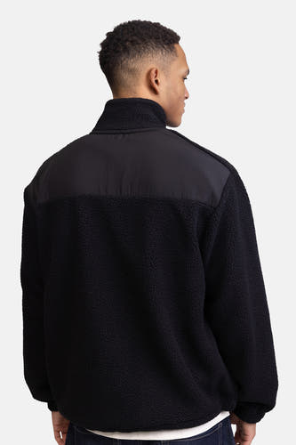 Fleece noir de REDEFINED REBEL, avec un tissu lisse sur la partie supérieure, vu de l'arrière.