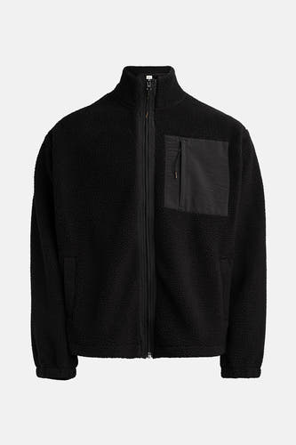 Fausse fourrure noire de REDEFINED REBEL, avec fermeture éclair et poche poitrine en tissu contrastant.