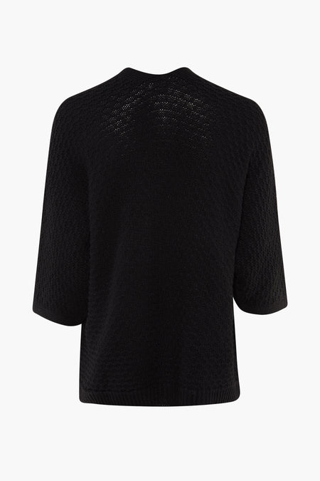 Zwarte cardigan van Terra di Siena, met een fijn gebreide textuur en korte mouwen, gezien van achteren.
