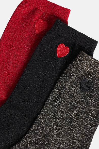 Chaussettes multicolores de Morgan De Toi, avec des paillettes et des cœurs décoratifs en rouge, noir et or.