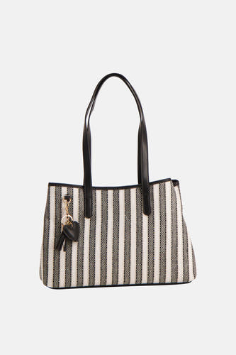 Sac à bandoulière noir Morgan de Toi à rayures verticales.