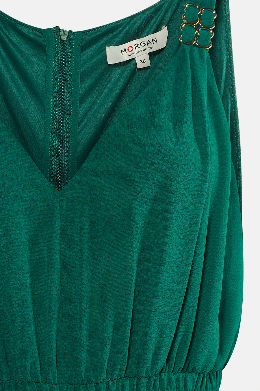 Combinaison verte Morgan de Toi, avec fermeture éclair et détails dorés décoratifs sur les bretelles.