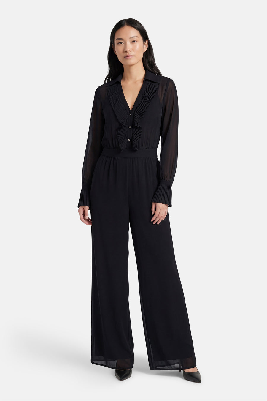 Combinaison noire Morgan De Toi, à manches longues, col plissé et jambes larges.