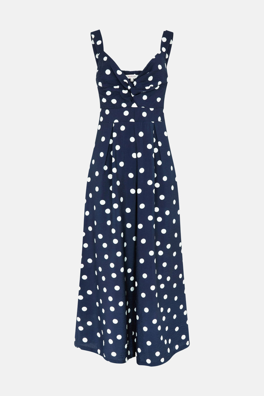 Donkerblauwe jumpsuit van Morgan De Toi met witte stippen, een knoopdetail bij de buste en wijde pijpen.