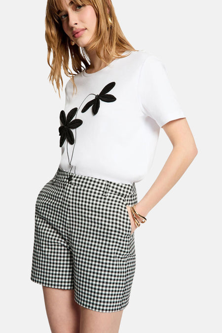 Zwarte short van Morgan De Toi met een zwart-wit geruit patroon.