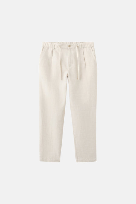 Pantalon écru de MANGO avec une taille élastique et un cordon de serrage.