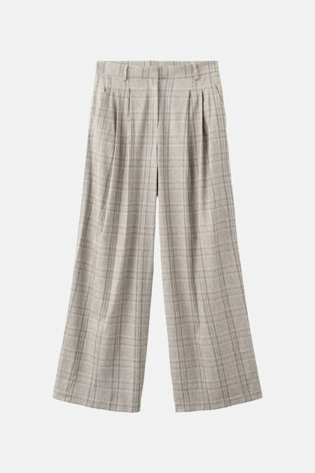 Beige broek van MANGO, met een wijd model en een geruit patroon.