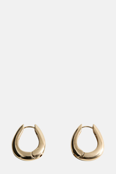 Gouden oorringen van MANGO, met een dik en afgerond ontwerp en een glanzende afwerking.
