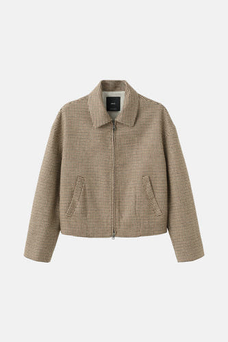 Multikleurige blazer van MANGO, met een houndstooth-patroon en een ritssluiting aan de voorkant.