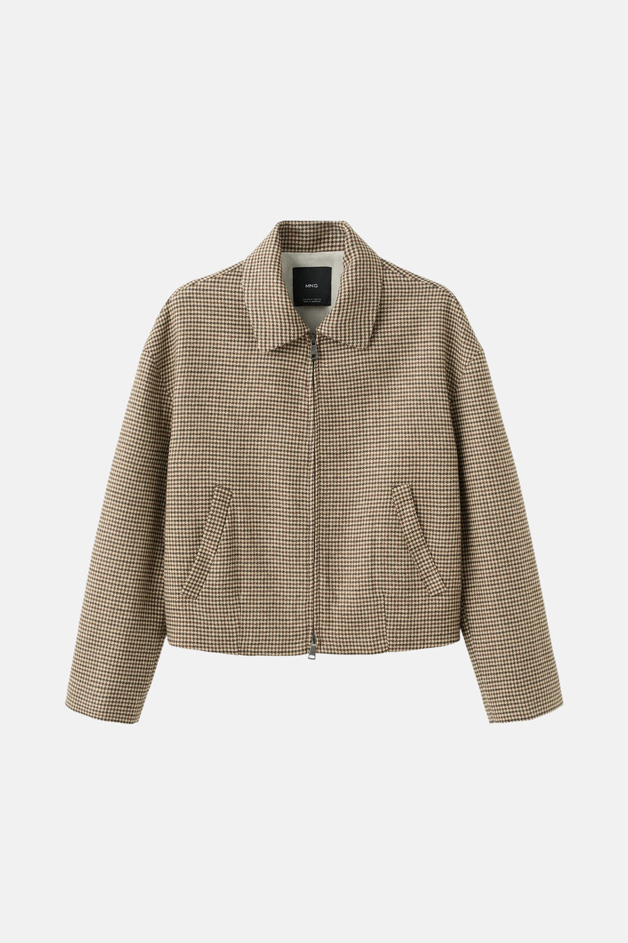 Multikleurige blazer van MANGO, met een houndstooth-patroon en een ritssluiting aan de voorkant.