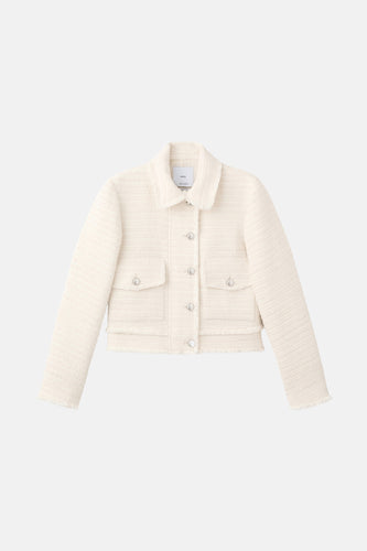 Gebroken wit bouclé jasje met knopen en zakken.