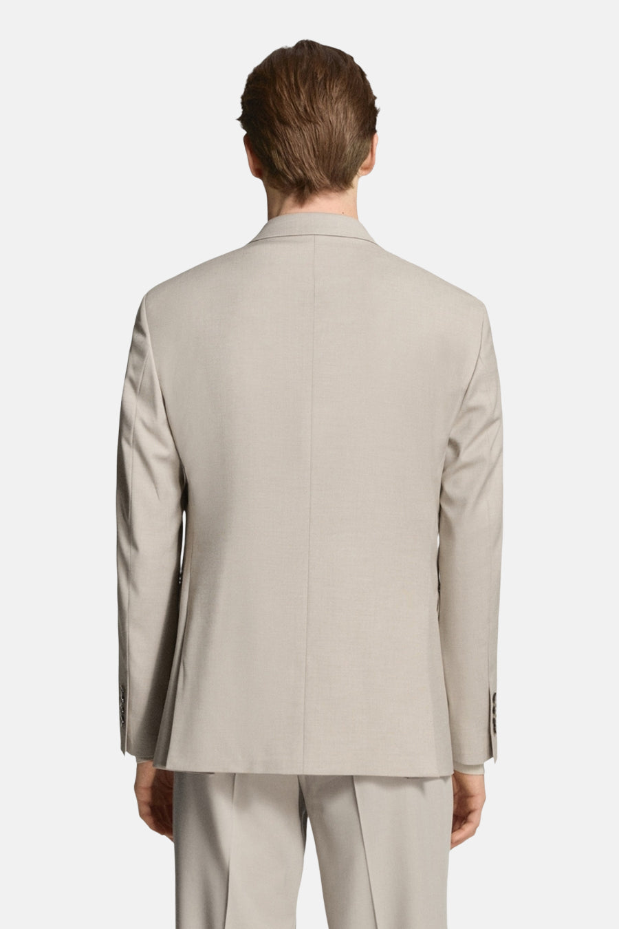 Blazer beige de MANGO, vu de dos, avec une texture lisse et une coupe soignée.
