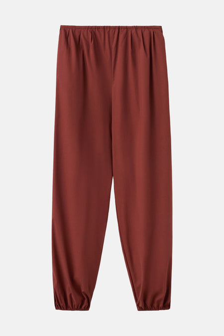 Pantalon marron de MANGO, avec une taille élastique et des jambes élastiques.