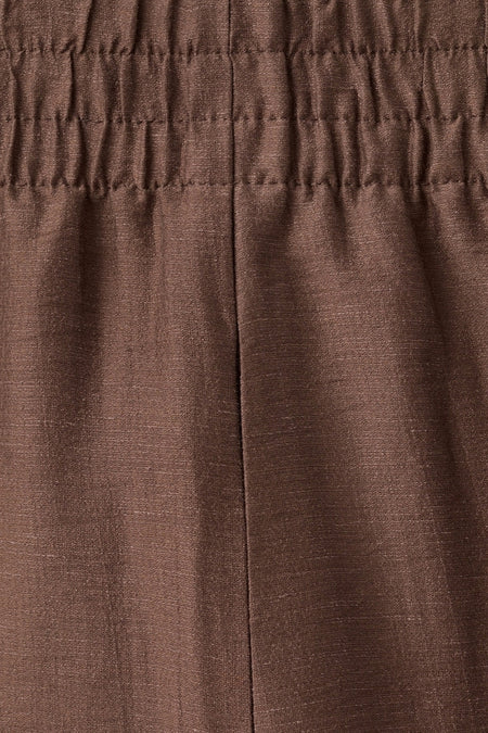 Bruine broek van MANGO met een geplooide elastische tailleband en verticale naad.
