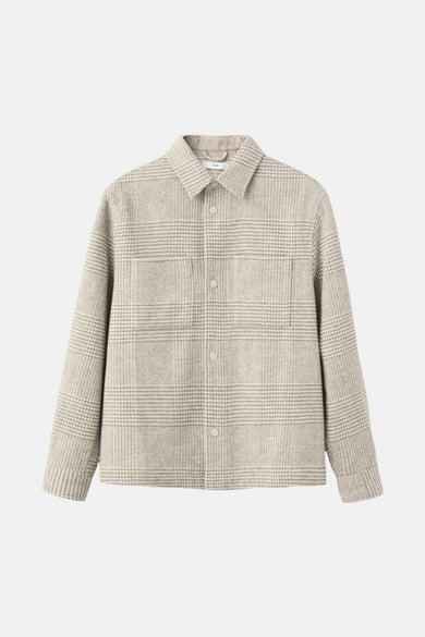 Manteau court beige de MANGO avec un motif de fenêtre subtil et des poches brodées.