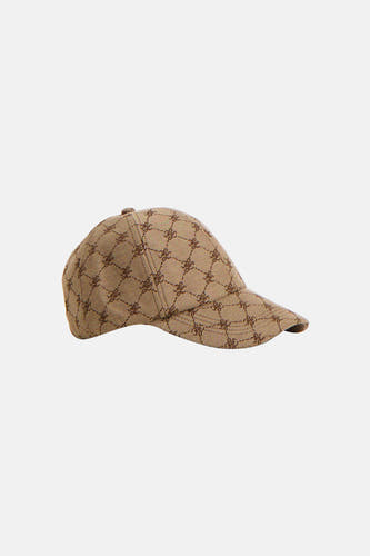 Casquette marron de MANGO, avec un motif et une visière courte, en vue de côté.