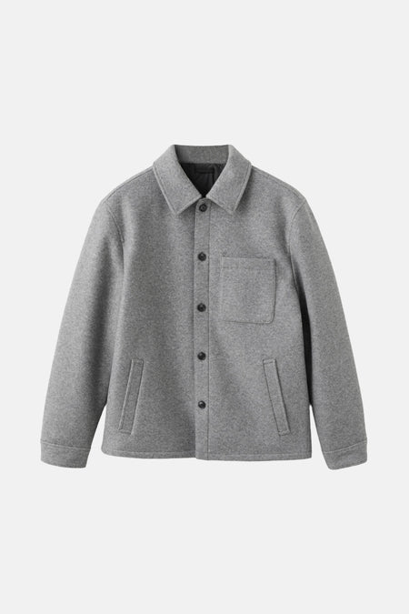 Grijze korte jas van MANGO, met lange mouwen, knoopsluiting en een opgestikte zak.