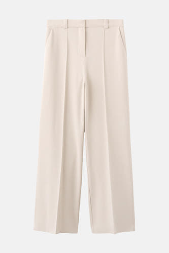 Pantalon beige de MANGO à jambes larges et de couleur unie.