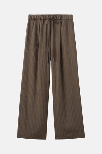 Pantalon marron de MANGO à jambes larges et taille élastique avec cordon de serrage.