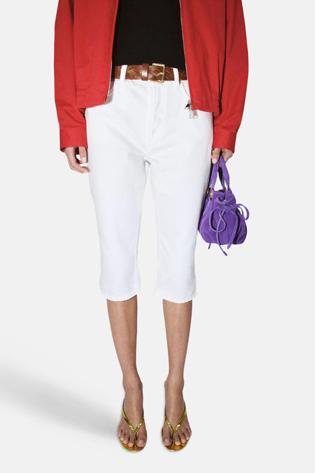 Pantalon blanc MANGO à 5 poches, coupe droite et fentes à l'ourlet.