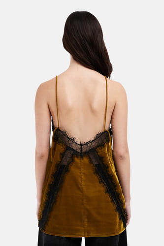 Blouse verte sans manches de TOPSHOP, avec des détails noirs sur le col et les côtés.