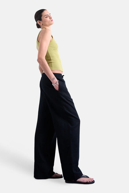 Pantalon noir TOPSHOP, à jambes larges et avec cordon de serrage à la taille.