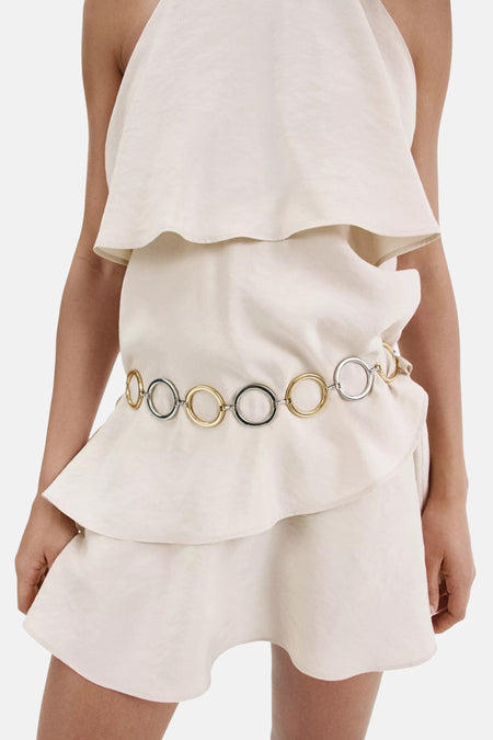 Beige mouwloos kleedje van MANGO met ruches en metalen ringen aan de taille, vooraanzicht