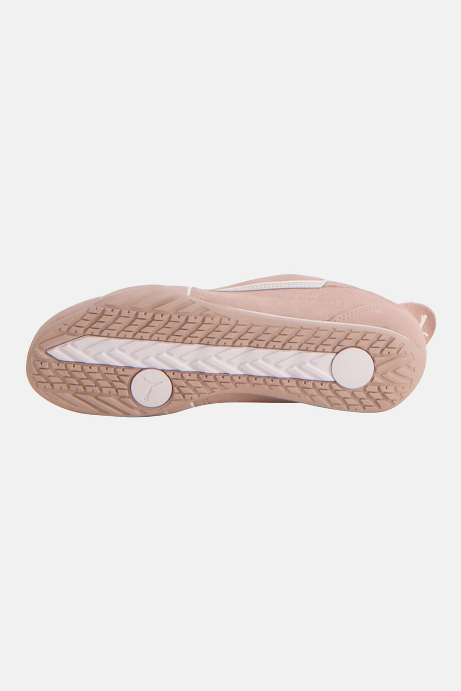Baskets roses de PUMA, avec une semelle blanche et un motif de formes géométriques sur la partie inférieure.