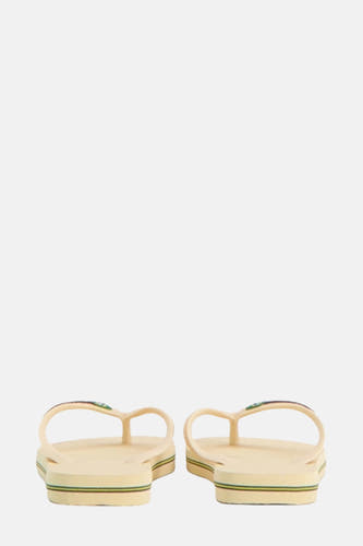 Beige slippers van Havaianas met gestreepte zool en logo op de bandjes, achterkantweergave.