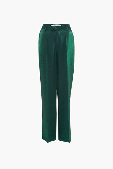 Pantalon vert de PULZ, avec une texture brillante et une poche latérale partiellement visible.