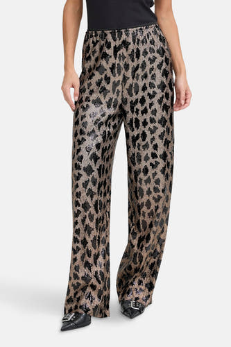 Pantalon noir de PULZ avec un imprimé léopard frappant et une finition pailletée.