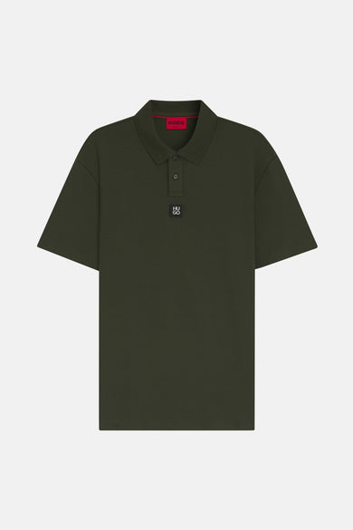 Donkergroene HUGO poloshirt.