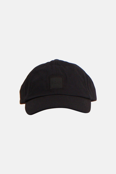 Grijze pet van HUGO BOSS ORANGE met een subtiel logo op de voorkant.