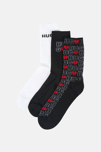 Multikleurige sokken (multipack) van HUGO, met een witte sok en twee zwarte sokken met 'HUG'-patronen en rode harten.
