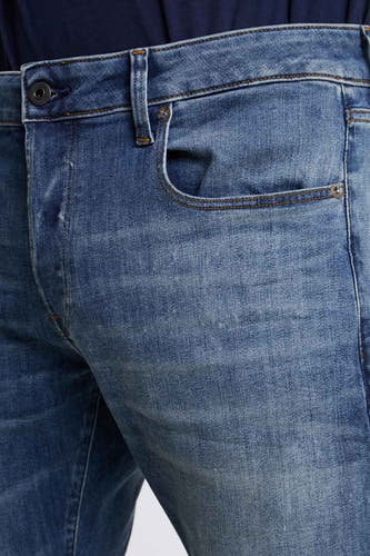 Blauwe slim fit jeans van G-Star RAW, met een lichte wassing en subtiele stiksels.
