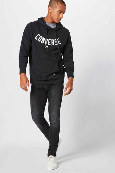 Grijs skinny jeans van G-Star RAW, met een verwassen effect en gedragen met een zwarte hoodie met merklogo.