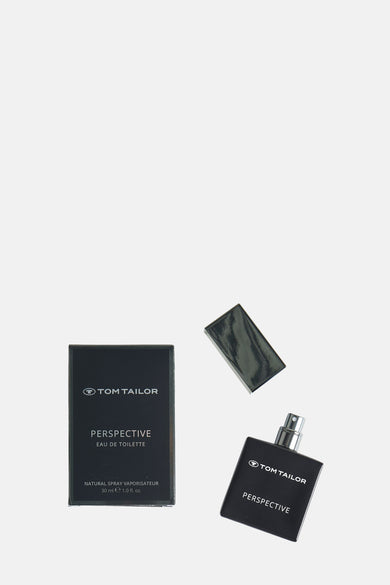 Parfum noir de Tom Tailor, posé à côté du l'emballage etopop