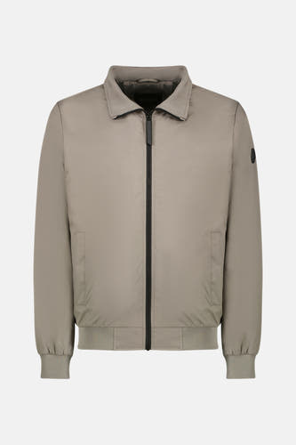 Manteau court beige de Cars, avec une couleur unie et des bordures à fines bretelles à l'arrière.