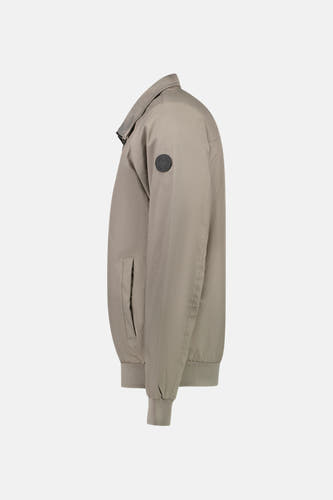 Beige, manteau court de Cars, avec une poche po po et des manches élastiques en vue latérale.