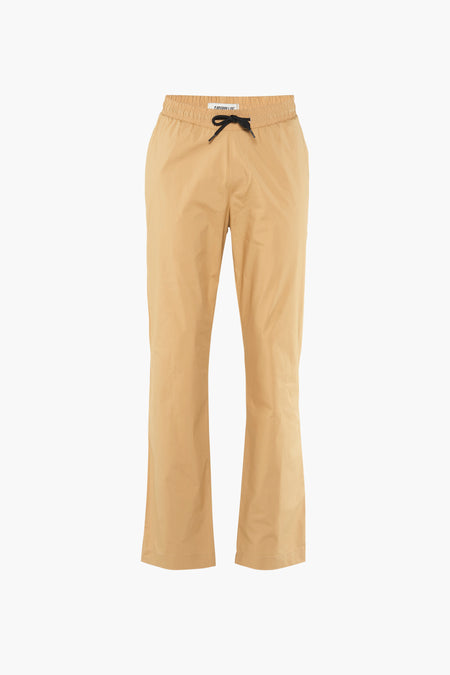 Beige broek van CATERPILLAR, met zwarte trekkoordsluiting en wijde pijpen.
