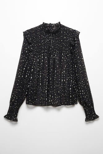 Blouse noire de MANGO avec des manches longues, des plis et un motif à points.