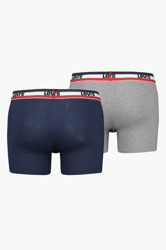 Blauwe boxershorts van Levi's, met grijze boxershorts op de achtergrond, met de merknaam op de tailleband.