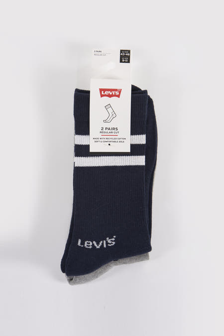 Chaussettes bleues et grises de Levi's avec des rayures blanches et bleu foncé, sur un fond blanc.
