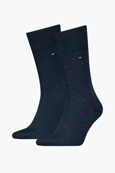 Blauwe sokken van TOMMY JEANS met rood stippenpatroon en logo detail.
