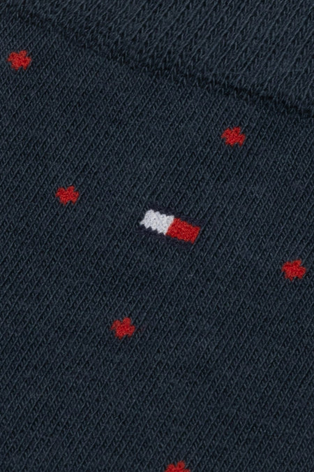 Blauwe sokken van TOMMY JEANS met rood klaverblad motief en subtiel logo.
