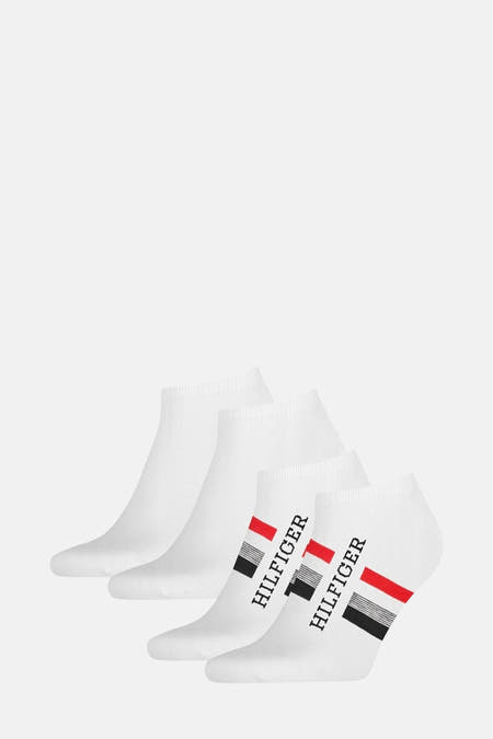Witte sokken van TOMMY JEANS, met een diagonale rode en zwarte streep en 'HILFIGER' erop.