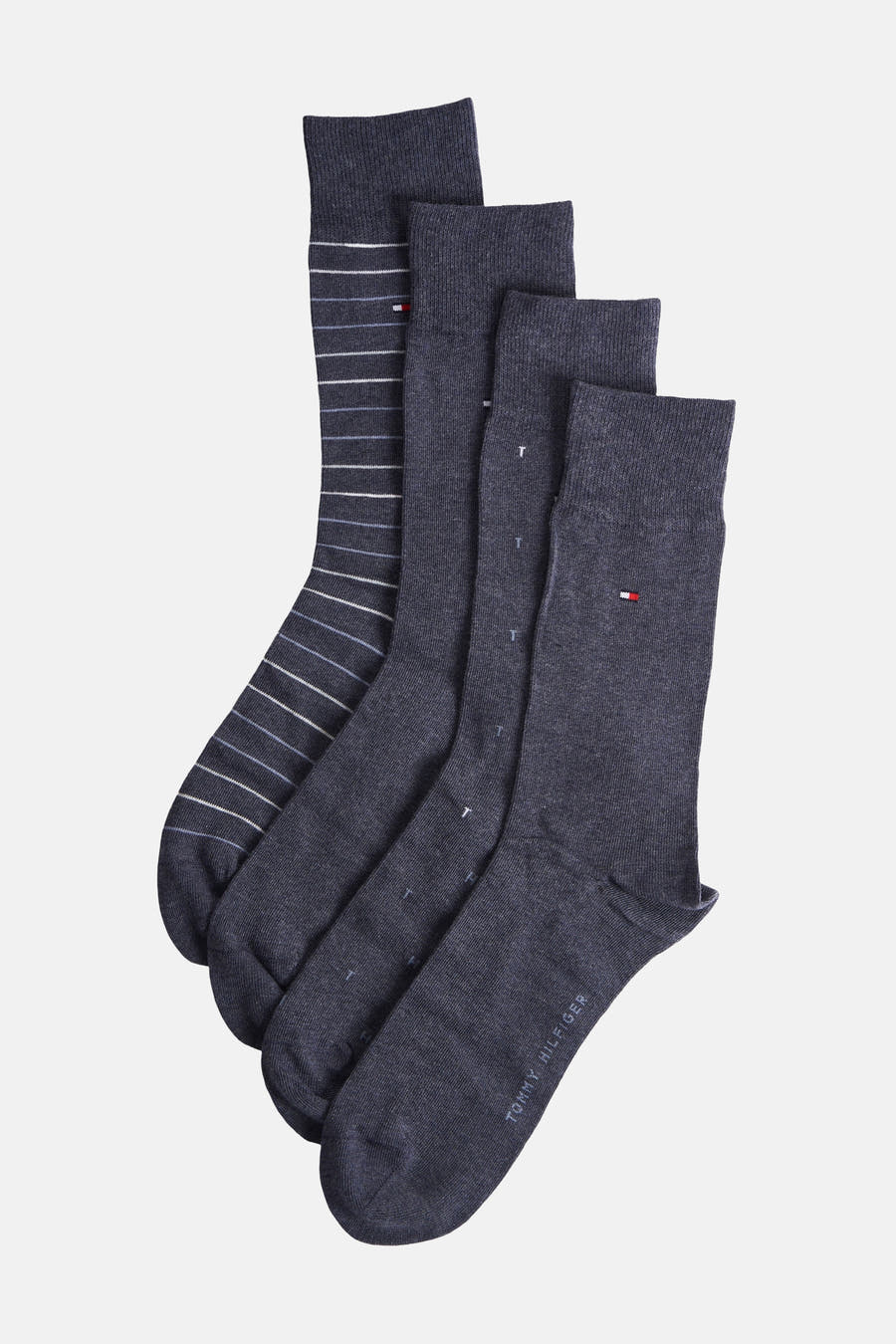 Chaussettes bleues de TOMMY JEANS, emballées dans une boîte bleue avec un motif de logos.