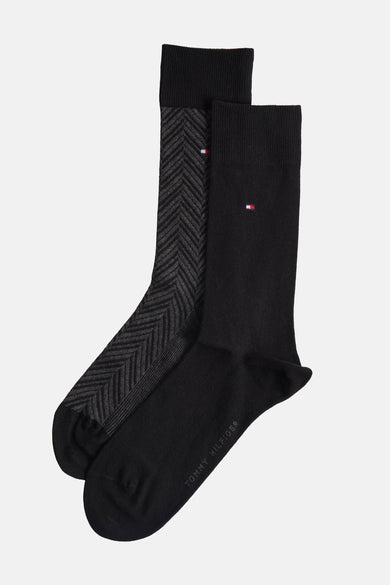 Chaussettes noires de TOMMY JEANS, avec une chaussette lisse et une chaussette à motif rayé.